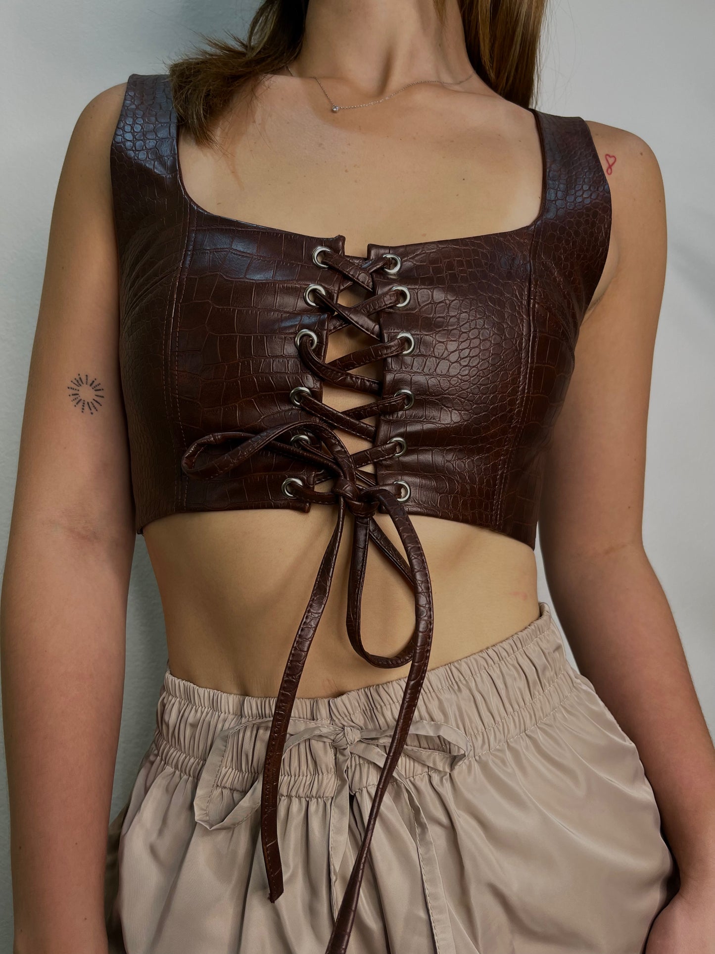 Laced leather crop top